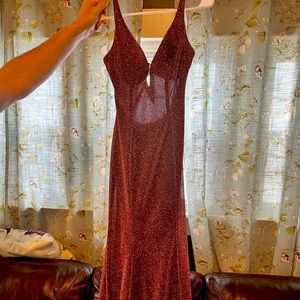 Maroon sparkly long dress.
